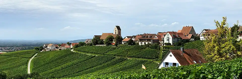&nbsp;Panoramic view of Ötlingen from the southeast; the hilly landscape is typical for the region of Markgräflerland