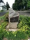 a monument to the 250th anniversary of the village