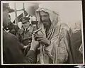 Nayef bin Hathleen handing his pistol to a British officer