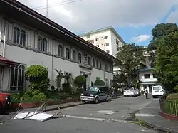 The old municipal hall of San Juan, with the San Juan Medical Center in the background. No longer existing. It was replaced with front extension of San Juan Medical Center.
