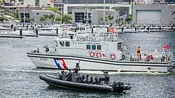 M109 assault boat alongside a Coast Guard Administration patrol boat