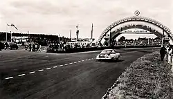 Cunningham's Cadillac Series 61 "Petit Pataud" passing under the Dunlop Bridge during the race.