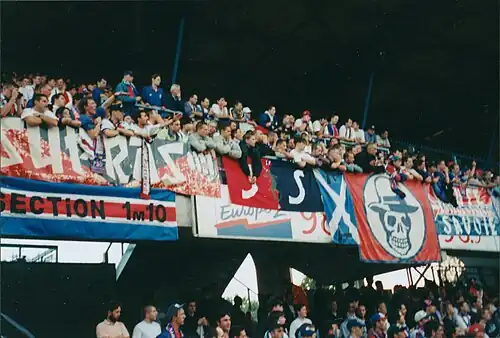 Away supporters (away sector) at the Division 1 match between AJ Auxerre and FC Paris Saint-Germain (2:3) on 7 August 1997 in front of 20,000 spectators at the Stade de l'Abbé-Deschamps.