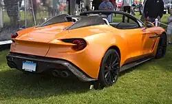 Rear-three quarters view of an orange convertible