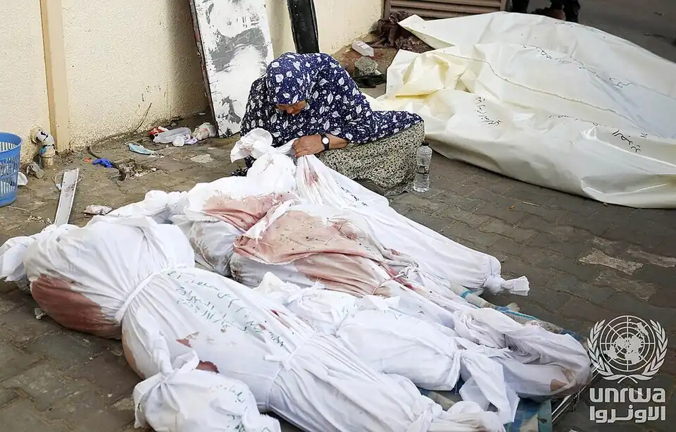 A Palestinian woman mourn her relatives killed in the Israeli airstrike of Deir el-Balah, Gaza Strip in 2023.