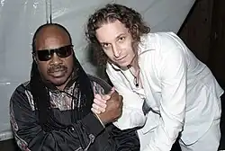 Kobi Arad (right) with Stevie Wonder (left)