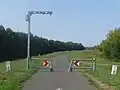 Narrowed passage at the Tisza Cycleway in Hungary with cameras to count cyclists