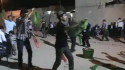 Achomi men dancing in Bidshahr