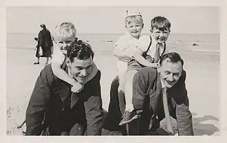 People playing on the beach circa 1952