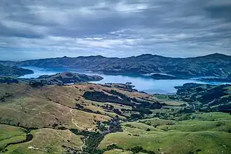 A photo of Akaroa Harbour with Ōnawe Peninsula clearly visible