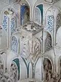 Extreme close-up of carved and painted details in constituent niches of a muqarnas dome in the Sala de los Reyes in the Alhambra
