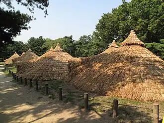 Reconstructed Neolithic-period huts in Amsa-dong, Gangdong District, Seoul