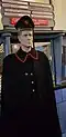 Post office: a mannequin of a post official in uniform with cap