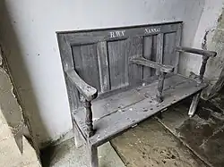 An original bench from Nannau Hall, now located at St Machreths Church in Llanfachreth