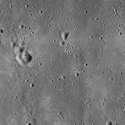 Lunar Orbiter 5 image from 1967, cropped to show the vicinity of the landing site of Apollo 11, used in mission planning. The image is centered precisely on a small crater called West crater (190 m in diameter), and the Lunar Module Eagle touched down about 550 m west of West Crater. The area shown is approximately 25 km × 25 km across.