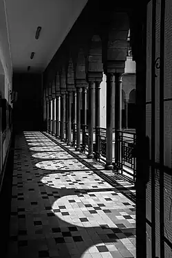 Shadows of arches fall along one of Wilaya's external balconies
