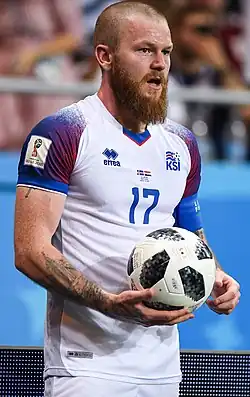 A footballer with a large beard