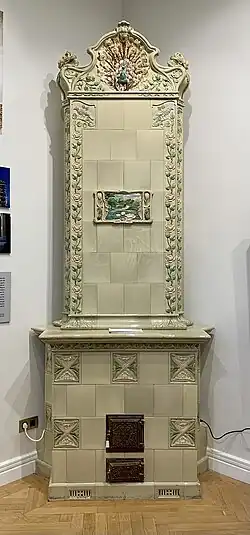 Polychrome tiled stove in the Mița the Cyclist House (Strada Biserica Amzei no. 9) in Bucharest, by Nicolae C. Mihăescu (1908)[222]