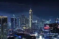 The Metrobank Center at night as seen from Makati City