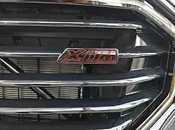 XM badge on the grille