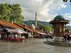 The entrance to the Baščaršija district, the old town of Sarajevo, including the Sebilj fountain
