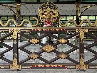 A railing in Bangsal Manis with Javanese Kāla