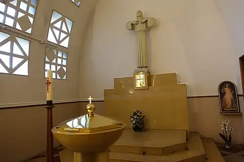 Chapel of Sacre Coeur, wih baptismal font. Statue of Salcre-Coeur by Raymond Delamarre (1890-1986)