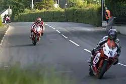 Motorcyclists in Barregow competing in the Isle of Man TT race