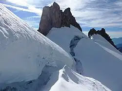 Rocky peaks protruding from undulating ice masses