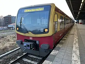 Red and yellow train at platform