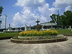 Decorative fountain surrounded by flowers