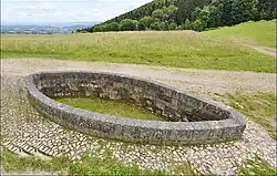 Bibracte oppidum, monumental stone basin, France
