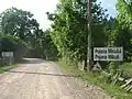 Polish-Romanian bilingual sign at the entrance in the village of Poiana Micului (Polish: Pojana Mikuli)