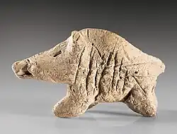 A clay boar figurine from the Neolithic period, found at Tepe Sarab, kept at the Museum of Ancient Iran