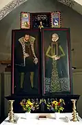 The retable in the monastery church of Bosjö #1, featuring votive portraits of the couple who donated it, Peter Bille and Birgitte Laxmand