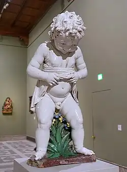A glazed terracotta statue of a puer mingens, Andrea della Robbia, c. 1490, Bode Museum, Berlin