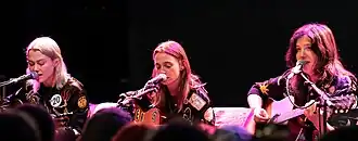 Boygenius performing in 2023. Left to right: Phoebe Bridgers, Julien Baker, and Lucy Dacus