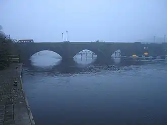 A mist covered stone bridge