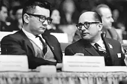 Black and white photograph of Gilberto Vieira on the right and Dr. Armando Hart on the left at the 6th congress of the Socialist Unity Party of Germany in 1963.