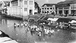 Another view focusing on a group of local cloth-washer in the canal.