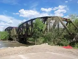 Columbus and Ohio River Railroad bridge over Tuscarawas River next to U.S. Route 36 leads into Gnadenhutten, Ohio
