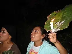 Cacaopera woman holding a candle in Morazan, El Salvador