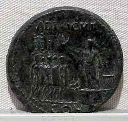 Coin of Emperor Caligula showing several aquilae at the left.