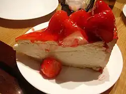 A slice of strawberry cheesecake