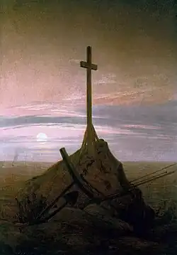 The Cross Beside The Baltic (1815), 45 × 33.5&nbsp;cm. Schloss Charlottenburg, Berlin. This painting marked a move away from depictions in broad daylight, to return to nocturnal scenes, twilight and a deeper poignancy of mood.[93]