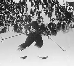 Christl Cranz skiing in front of a crowd