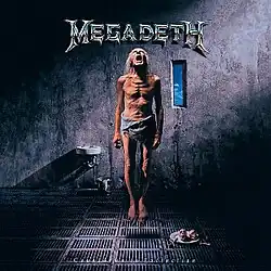 1 old skinny man looking up w/ open mouth (center), band name (top), album name (bottom)