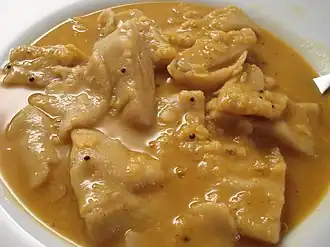 Yellow daal with thick wheat flour dhoklis in it.