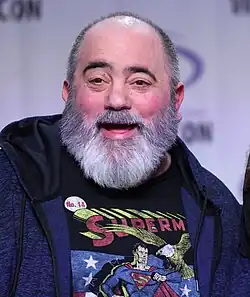 Slott standing and smiling