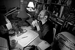 David van de Pitte at his writing desk. Photo by Eric van den Brulle